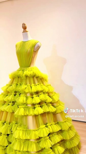 RAIN CELMAR's Atelier Arcusa gown for ABS CBN BALL 2025 A true celebration of craftsmanship and couture, this Carlarcusa creation is a breathtaking ode to spring’s beauty and renewal. Designed with hundreds of yards of the finest tulle, the gown cascades in layers of voluminous ruffles, mimicking the soft, organic flow of blooming petals in a lush garden. The structured bodice, sculpted to perfection, offers a striking contrast, a balance of dainty femininity and bold confidence. The vibrant bot