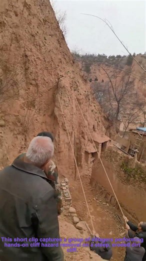 Manual Cliff Hazard Removal: Rope-Pulled Soil Clearing