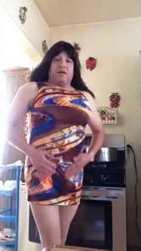 crossdresser colorful mini dress cooking video