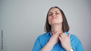 Woman thyroid gland control. Middle aged lady sweeping the laryngeal, laryngitis, goiter or Hypothyroidism. Disorder of the endocrine system. Hashimoto’s Thyroiditis, Lymphocytic Thyroiditis.