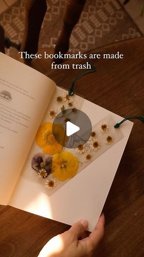 Sibia Torres Padilla | DIYs on Instagram: "I shared this idea a year ago and it’s still one of my favorites. It’s so simple and only requires a few materials. This time I added clips of the other bookmarks we have made since first, you’re going to want to get your clear containers and cut out your rectangles. you can use spinach containers, strawberry or blueberry containers, any clear plastic you’re looking to toss I had a lot of questions about whether I pressed two pieces of clear plastic tog