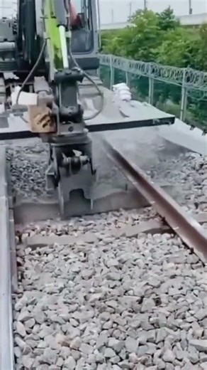 the process of cleaning and removing old iron on railway tracks