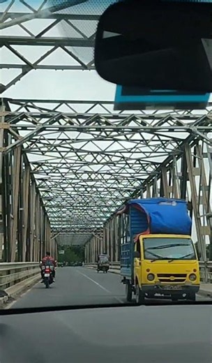 Steel frames, open roads, and endless journeys. 🚗✨ #ontheroad #bridgeview#scenicviews #shorts #reels