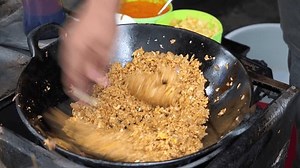 The process of cooking Javanese fried rice by a cook or chef over a large hot skillet. Nasi goreng jawa (Indonesian for Javanese fried rice, Javanese: sega goreng jawa) is fried rice from Java.