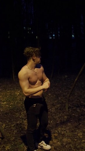 Muscular Male in Twilight Woodland Setting