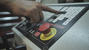 Worker operating an industrial lathe  - Free Stock Video