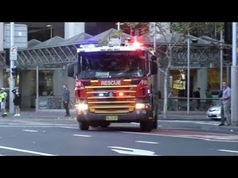 Fire & Rescue + Ambulance + Police Units Responding Fast to an Emergency in Sydney CBD