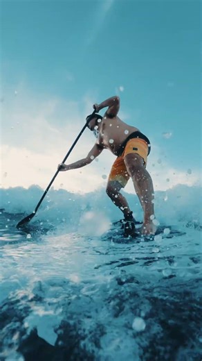 8' paddleboard catching a good wave on oahu