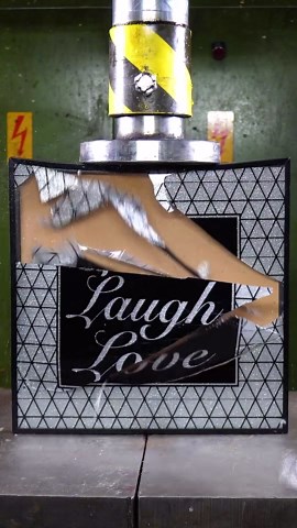 Grapes being crushed by hydraulic press