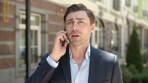 Portrait of man talking on phone about work | Free Stock Video Footage