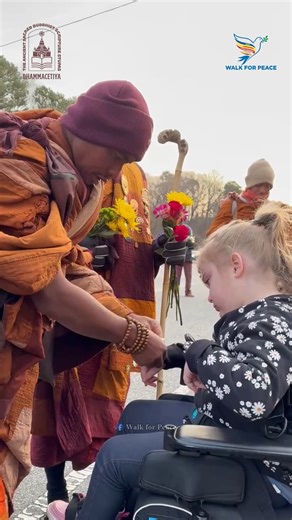 📸 This morning on our walk on Day 91 (1/24/2026), the venerable monks tied a peace bracelet and gave blessings to a young girl. May you and all beings be well, happy and at peace. 🙏✨ #WalkForPeace #PeaceWalk #Buddhistmonks | Walk for Peace