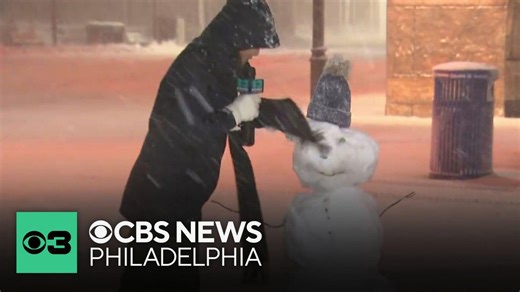 CBS News Philadelphia's Madeleine Wright makes snowman in Atlantic City