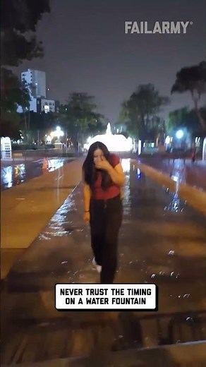 Woman Gets Soaked by Water Fountain 1920p 30fps H264 128kbit AAC
