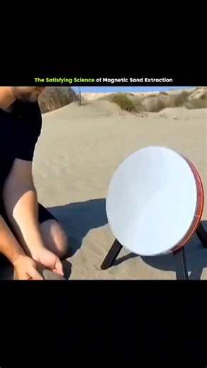 axisrnx18M on Instagram: "This video demonstrates the extraction of magnetic material, specifically magnetite or "black sand," from common beach sand. The process begins with a person pouring a large amount of sand over a circular, tilted device that appears to contain a strong internal magnet. As the sand flows across the surface, the non-magnetic grains fall away, while fine, dark metallic particles are trapped and cling to the disc, forming a textured, bristly layer. Once the extraction is co