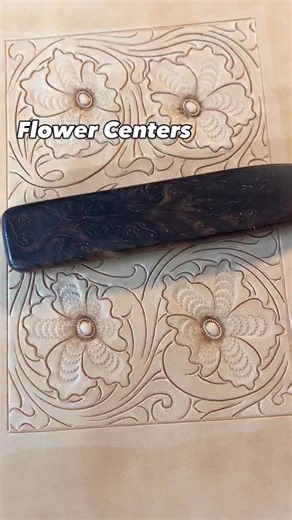 I’m stamping the flower centers a little differently than usual on this cover. Normally I would use a veiner to create the texture along the length of each petal but this time I’m using a camouflage stamp. This is an older technique that Al Stohlman used often in his work and his many publications on tooling and it works perfectly well still today. #tooltips #ontheworkbench #floralcarving #leathertooling #leatherwork #leathercraft #leatherworker #leathercrafter #carvedleather #tooledleather #lea