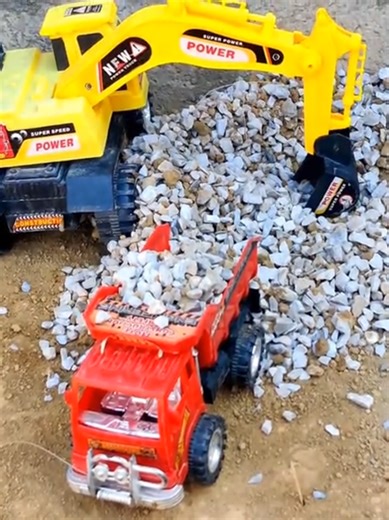 Mini Excavator Stone Loading with JCB
