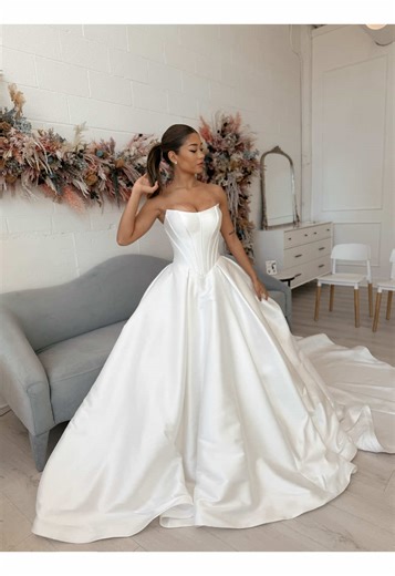 Big. Romantic. Effortlessly elegant ✨ Ball gowns are the ultimate statement—timeless, refined, and impossibly put together. This strapless beauty with a sculpted basque waist and breathtaking corset back brings all the drama while still feeling clean, classic, and elevated. If you’re dreaming of a gown that turns heads and defines the moment, this is that dress 🤍 #wedding #engagement #ballgownweddingdress #ballgown