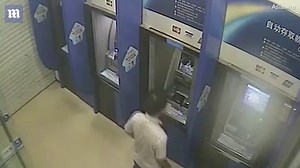Shocking moment man smashes ATM machines with a hammer