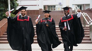Graduates running in campus and celebrating graduation