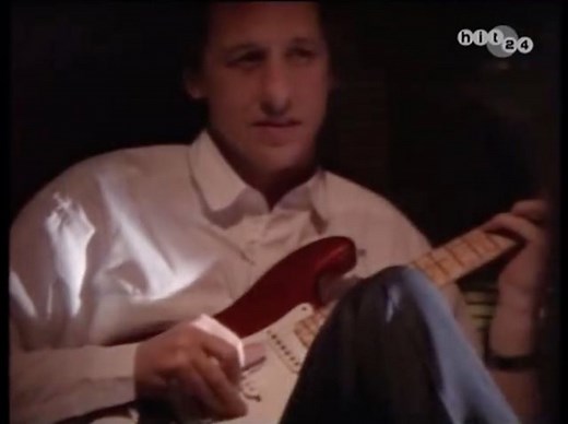 Spot Mark playing guitar in the Ben E. King video for 'Save The Last Dance For Me', taken from his 1987 album of the same name. | Mark Knopfler