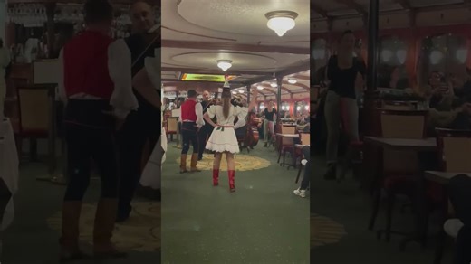 Performers entertaining the Danube river cruise tour guests with their traditional Hungarian dance