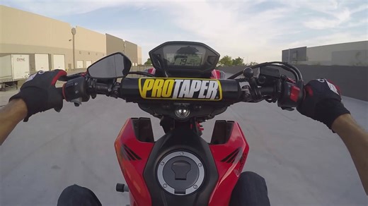 Perfectly executed straight-up vertical wheelie on the mini bike at maximum angle