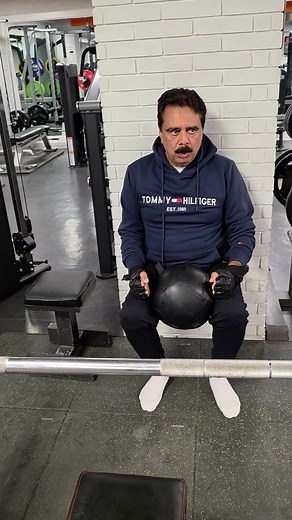 This is a wall squat variation with your toes slightly lifted and a medicine ball held in your lap. Here’s what this position does — and how effective it is for someone your age and fitness level. ✅ What This Exercise Works • Quads (front of thighs) Lifting the toes shifts the load more toward the quadriceps, making them work harder. • Core & Lower Back Stability The wall gives support, but holding the ball helps keep your core engaged. • Glutes (to a lesser extent) Because the wall supports you