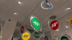 Sales signs in store, shopping discount signs in department store in shopping mall