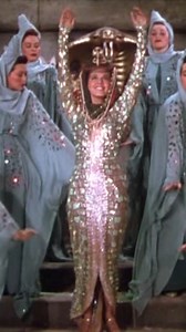 Maria "the Queen of Technicolor" Montez is swathed in satin and snakes in COBRA WOMAN (1944), a gloriously unhinged tale of tropical melodrama, evil twins, and volcano-side vengeance— all soaked in queer-coded spectacle. It is unabashed artificiality, with lavish costumes and gleeful melodrama, making it a foundational text for camp sensibility and queer subversion in classic Hollywood. So much so that it is revered by many queer filmmakers, including underground filmmaker Jack Smith (FLAMING CR