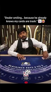 Dealer smiling... because he already knows my cards are trash!