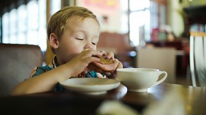 Young boy eating a sandwich - Free Stock Video