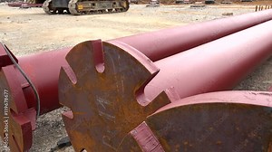 Metal support columns on a building site before installation. Stock Video