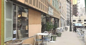 Surveillance video shows man smashing window with chair at Detroit bar