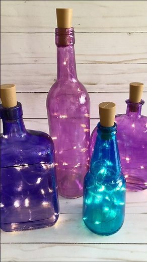 Create Fairy Light Bottles! Tint upcycled glass with Mod Podge and Food Coloring #crafts #diy