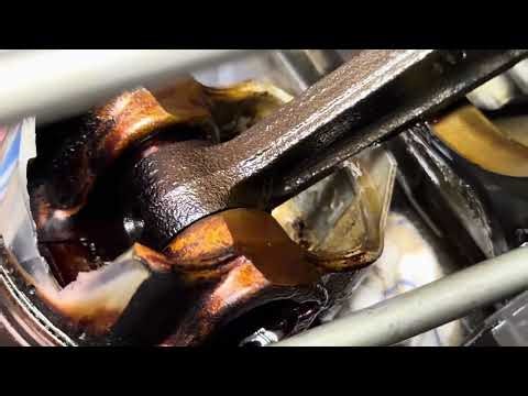 G6 variable valve timing system oil drain cleaning revealed a blown piston.