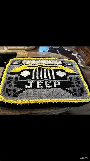 🚙 Yellow Jeep Hand-Knit Blanket 💛🖤 Jeep people just get it… and this blanket is made for them. Front and center is a bold yellow Jeep — grille, headlights, windshield, wheels, and the word Jeep right across the front. The whole design sits on a black and gray background and is finished with a double border in yellow and black that makes this blanket absolutely pop. This isn’t just cozy… it’s personality in blanket form. Blanket Size: 36” x 50” Price: $100 Hand-knit with thick chenille yarn, s