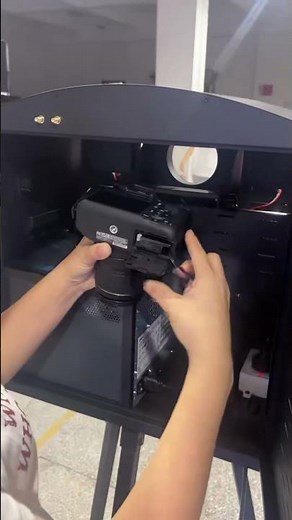 Install a dummy battery for the DSLR of the magic mirror photo booth.#photobooth