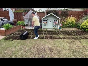 Walensee 24 inch Compost Spreader Being Used to Apply a Thin Layer of Compost Over a Reseeded Lawn