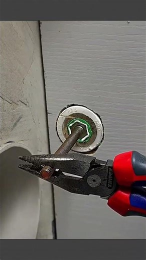 See how to remove a stripped screw embedded in the wall #lifehacks #plumbing #DIYrepair #shorts