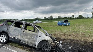 One person hospitalized after Clinton Township crash and fire