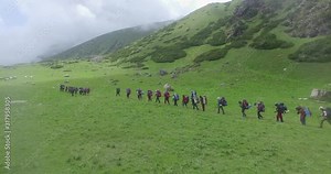 Himalayan mountaineers on their trail, on the way to their destination passing through Himalaya hills & Himalaya villages, Upper Himalayan range, Uttarakhand India. Aerial view of Himalayan hills.
