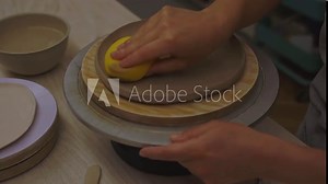 Using sponge for pottery class 4k video. Absorbing sponge to get rid of excess moisture. Applying more moisture on clay products. Smoothing clay with a sponge. Ceramics workshop.