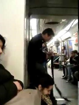 Crazy guy playing guitar in train