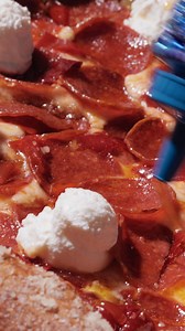 The drizzle hits and everything shifts. A wave of sweet heat rolls across the slice like it was made to wake the pizza up. | Mellow Mushroom