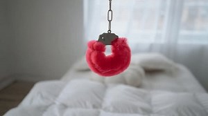 Pink Fluffy Handcuffs Lie On White Stock Footage Video (100% Royalty-free) 3436320259 | Shutterstock