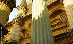 detailed close-up of medieval architectural elements featuring columns and capitals, highlighting the elaborate designs and historical significance of these classic features