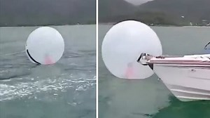 Moment boy, 8, is found floating inside a bubble in the middle of the sea