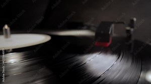 Playing a vinyl longplay on a record player - studio photography