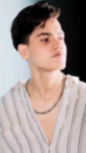 Casual Fashion Statement: Striped Shirt and Silver Chain