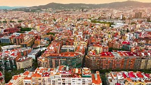 Aerial view of Barcelona Eixample district and Sagrada Familia Basilica, Spain. Barcelona street. Typical square quarters of Barcelona. Aerial view. Famous mediterranean destination in catalonia spain